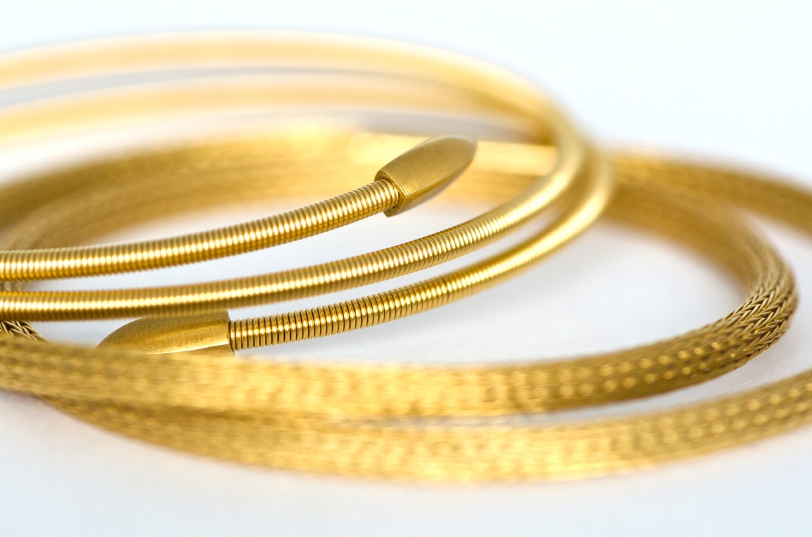 Bracelet spirale et collier tricoté en or jaune 750